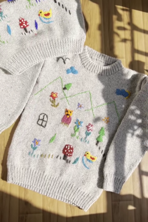 Whimsical Nature-Embroidered Knit Sweaters 🐥🍄🌼 – Light Gray Base with Playful Storybook Detailing